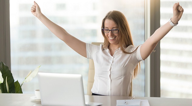 Happy business owner celebrating online success